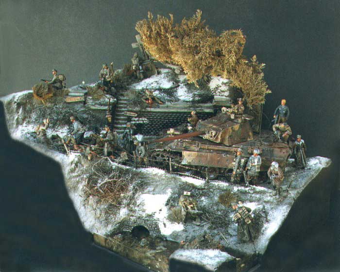 An overall view of the diorama demonstrates the graduated incline of the groundwork from the river bed at the bottom of the ravine to the small hillside clearing above the roadway. There is actually a balance to the chaos here. Whereas the Panther and Bonsai tree seem to dominate the right, the plethora of figurines on the left help to balance the scene. Note the randomness of the heavier patches of snow