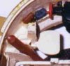 This small picture isolates the Commander's seat and the Counterbalance cylinder. A pistol holster and binoculars were put in the storage bin adjacent the seat.